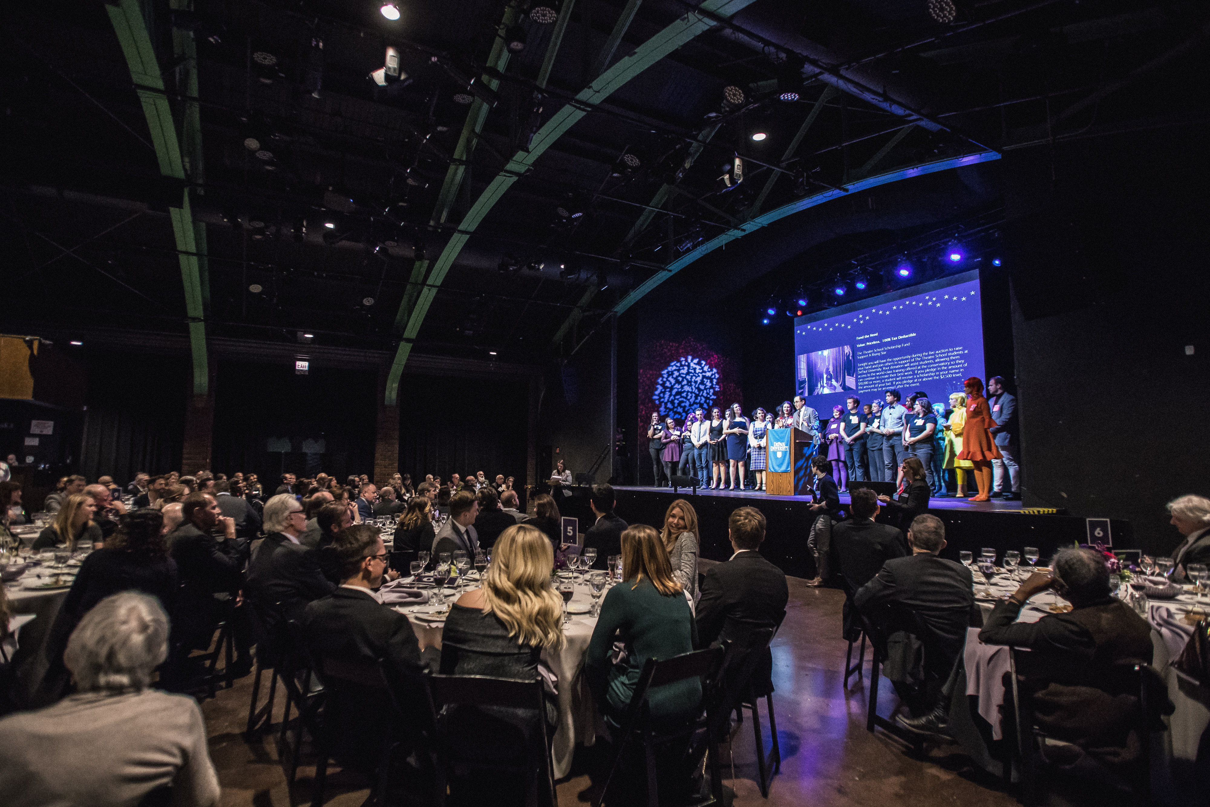 Guests listening to remarks made by the host of the evening, MFA Acting alumnus P.J. Byrne.
